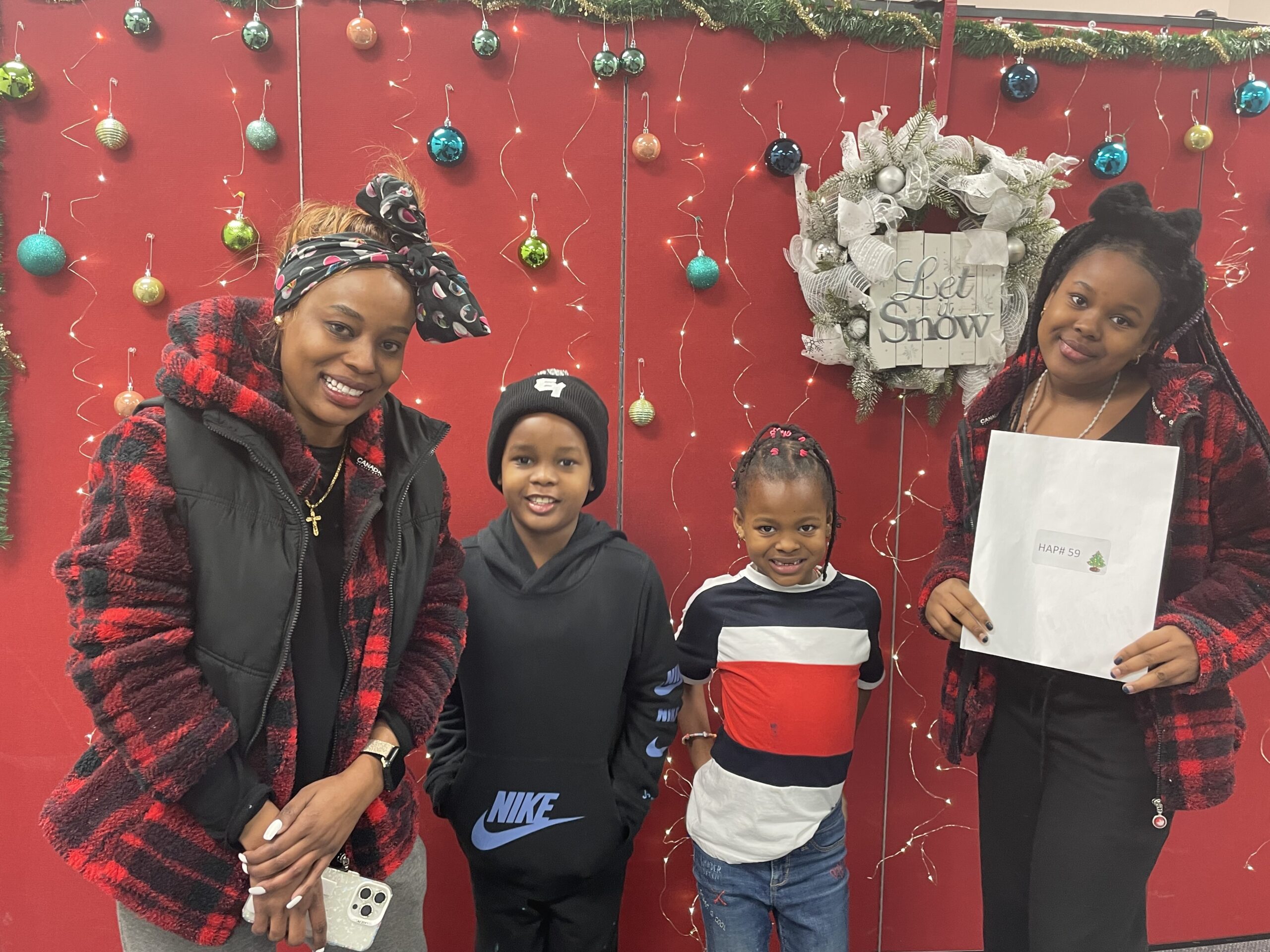 A program participant and sponsor at New Circles with Holiday gifts