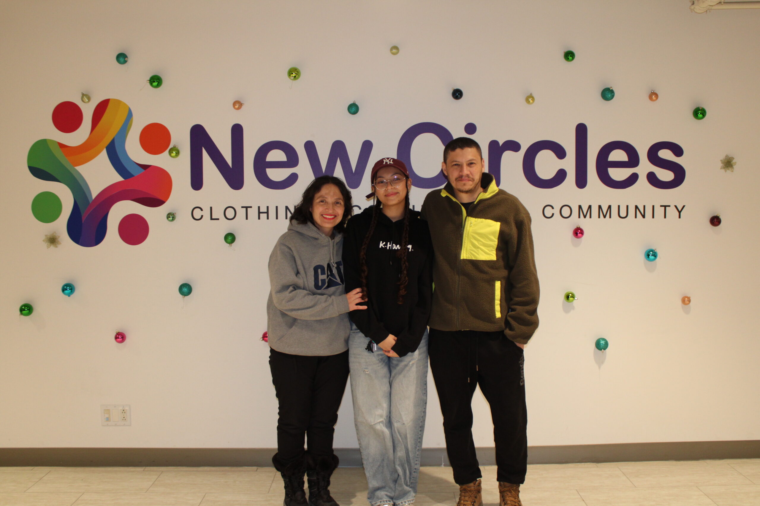 A program participant and sponsor at New Circles with Holiday gifts